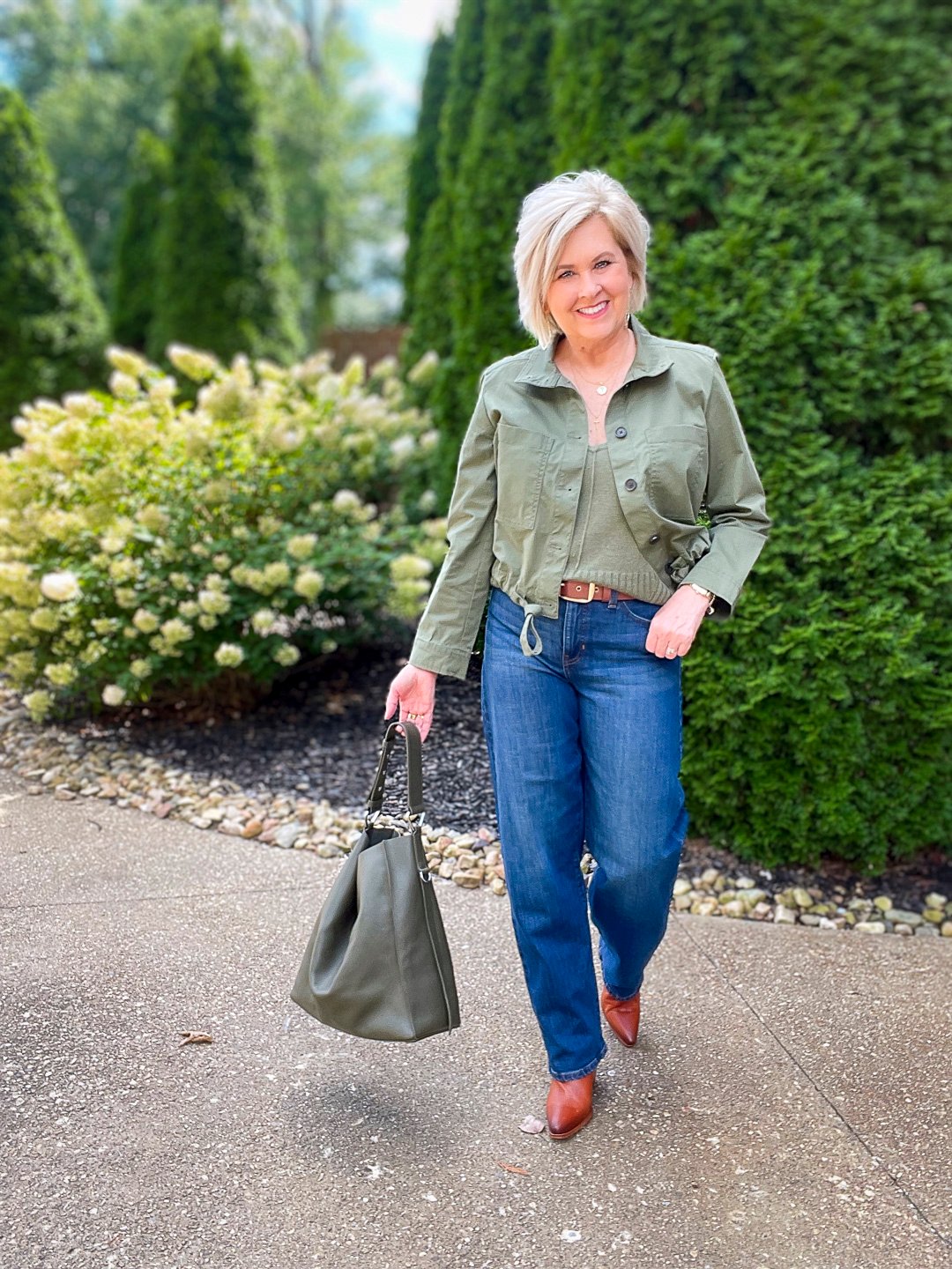 Over 40 Fashion Blogger, Tania Stephens is wearing an olive green jacket and sweater tank from Banana Republic10