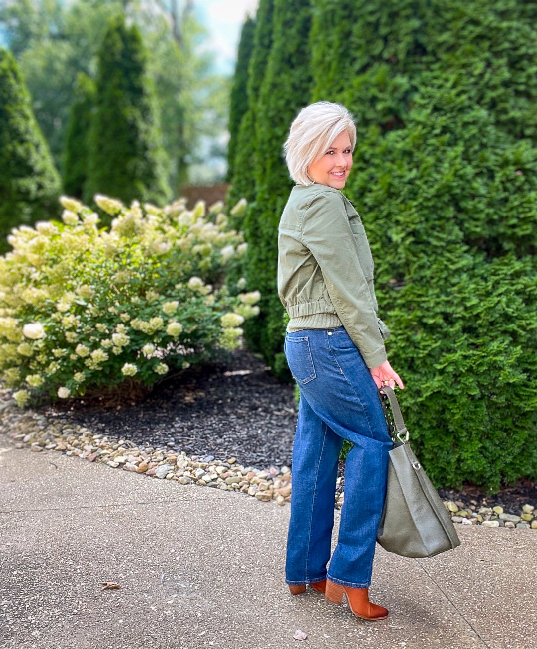Over 40 Fashion Blogger, Tania Stephens is wearing an olive green jacket and sweater tank from Banana Republic11