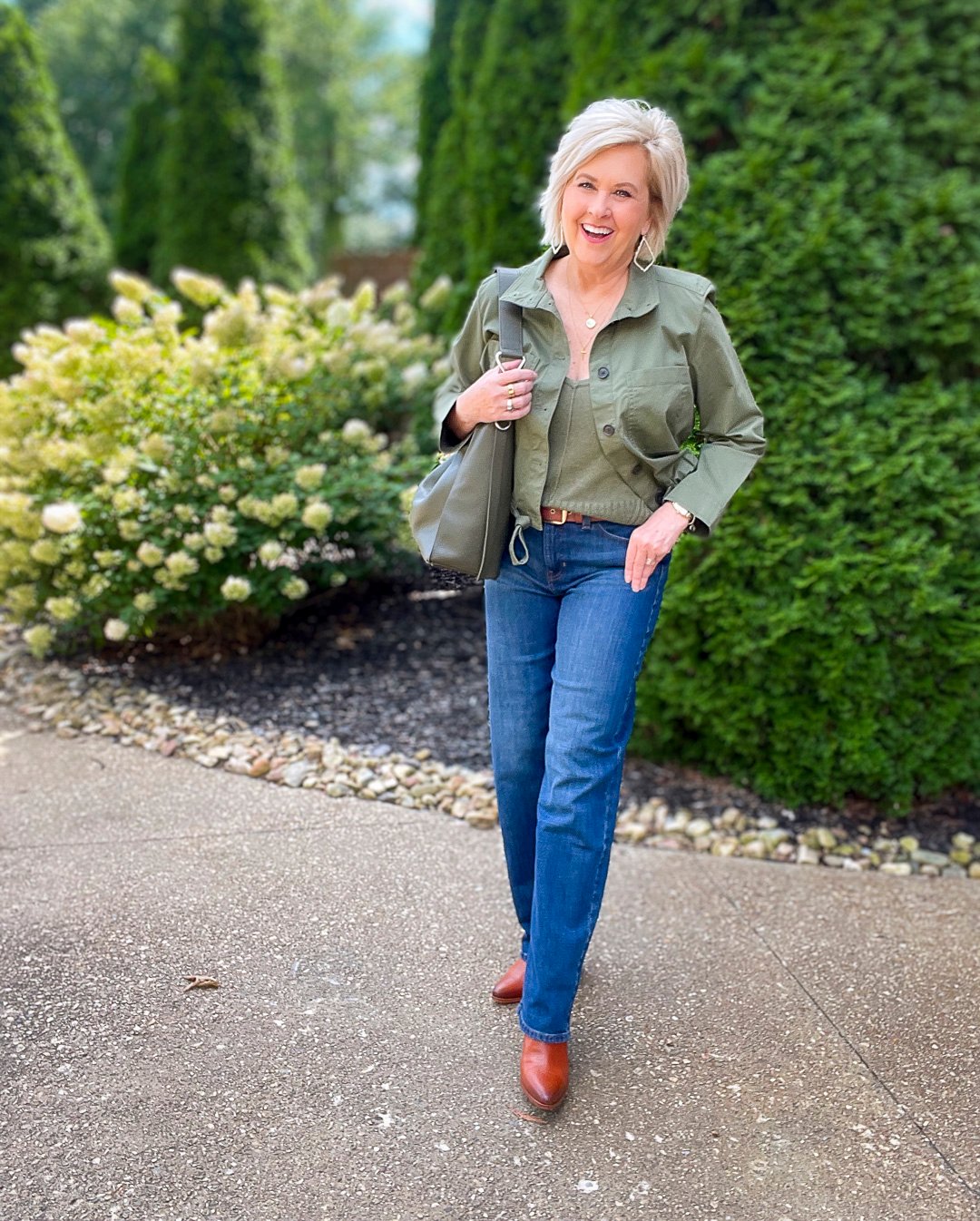 Over 40 Fashion Blogger, Tania Stephens is wearing an olive green jacket and sweater tank from Banana Republic7
