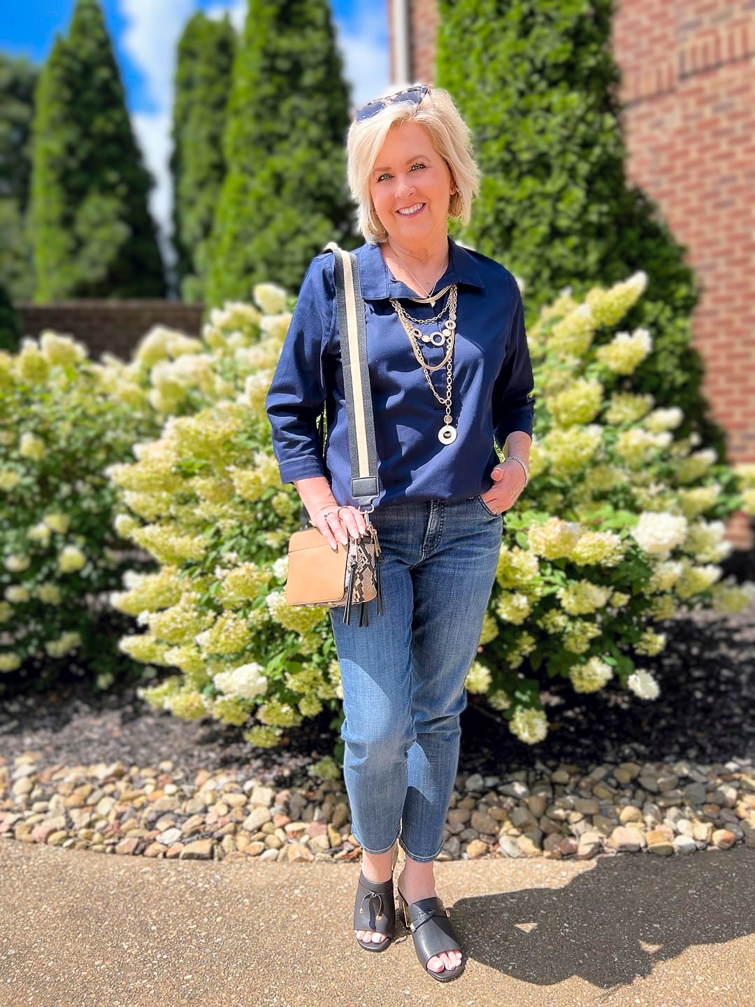 Over 40 Fashion Blogger, Tania Stephens is wearing a Chicos fall transition outfit with straight leg jeans
