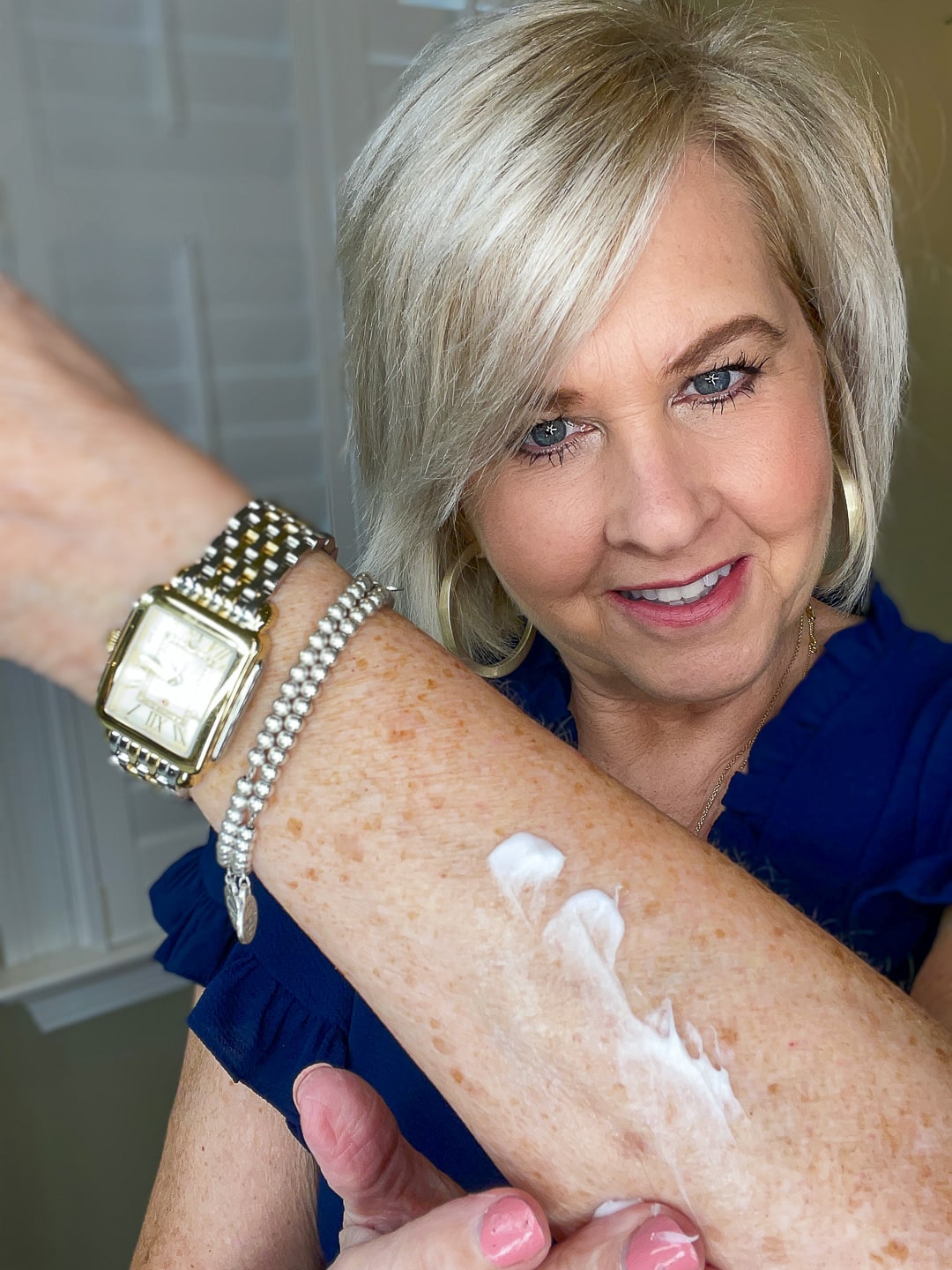 Over 40 Fashion Blogger, Tania Stephens is wearing a blue top and trying City Beauty's Inviscrepe Body Balm12