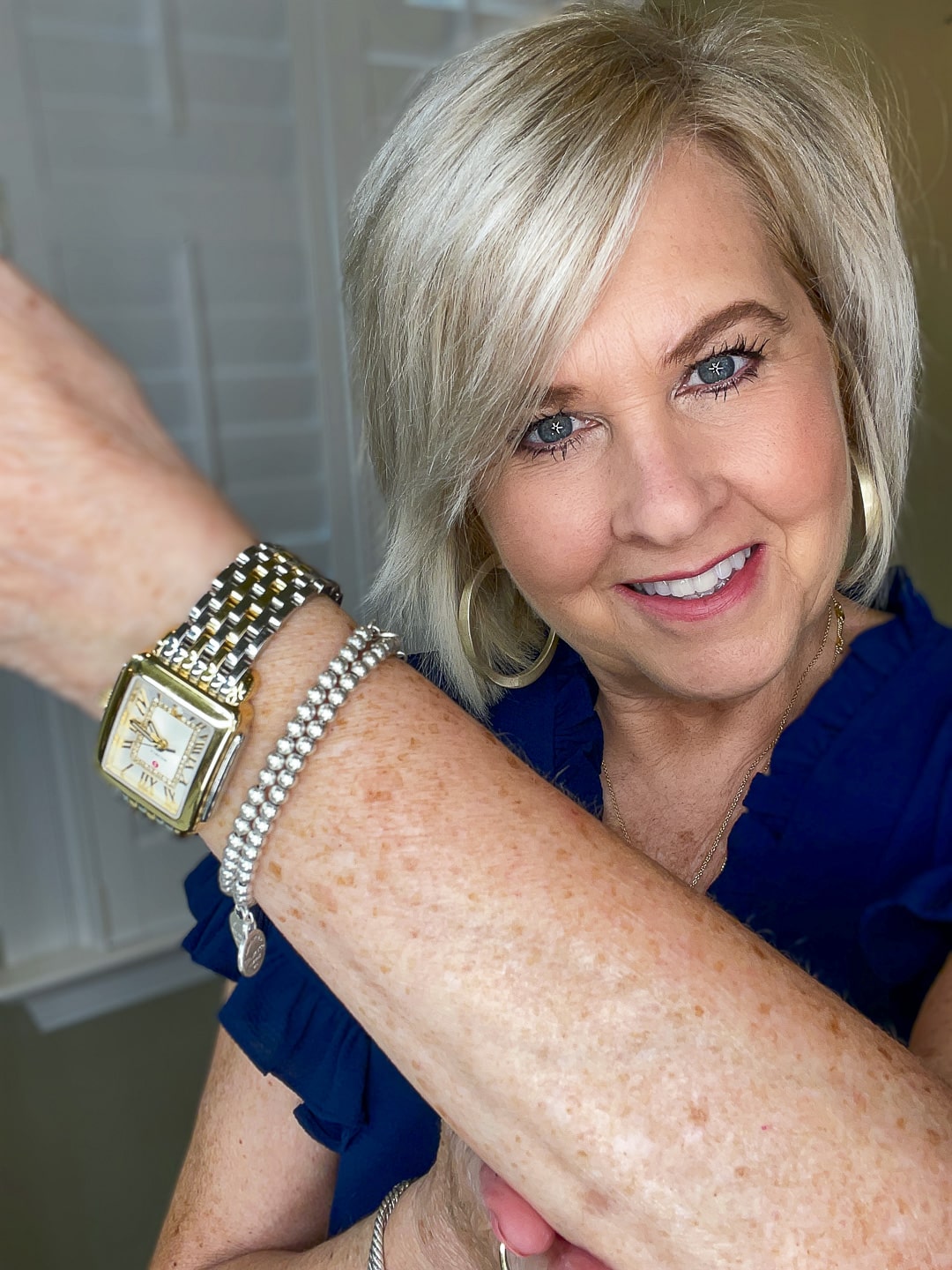 Over 40 Fashion Blogger, Tania Stephens is wearing a blue top and trying City Beauty's Inviscrepe Body Balm13