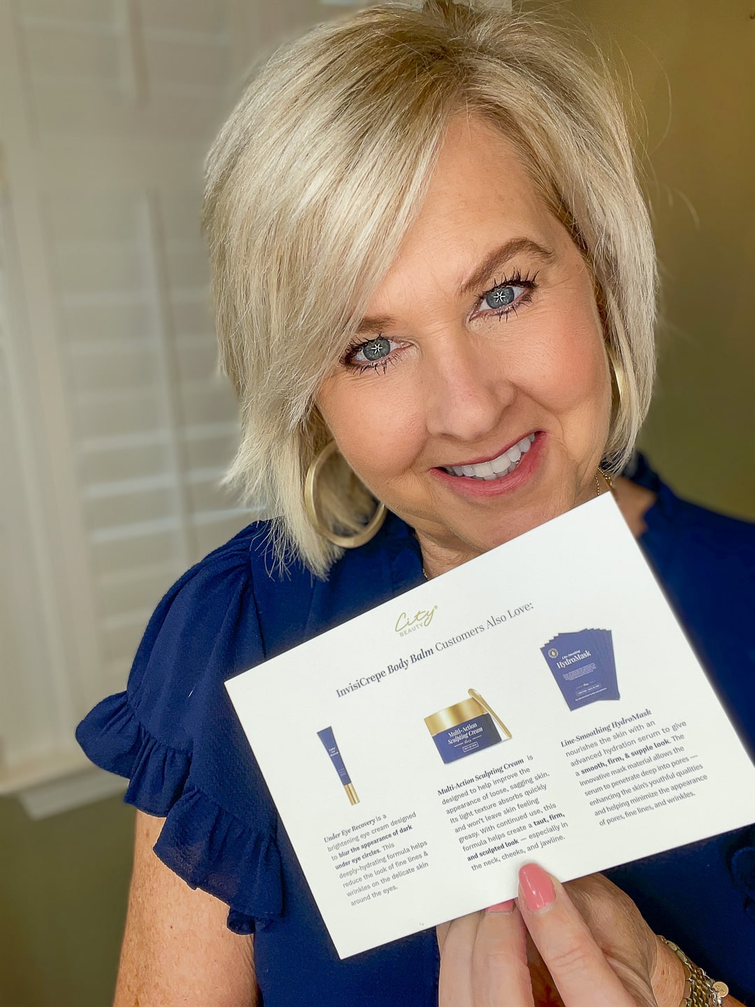 Over 40 Fashion Blogger, Tania Stephens is wearing a blue top and trying City Beauty's Inviscrepe Body Balm16