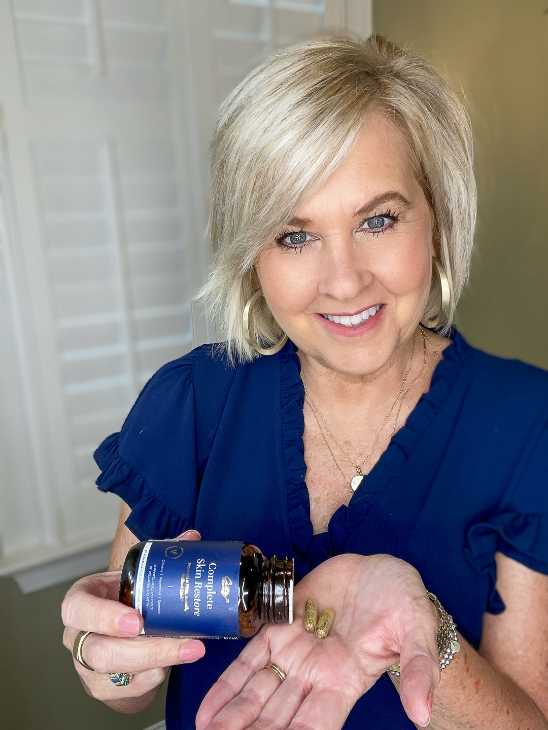 Over 40 Fashion Blogger, Tania Stephens is wearing a blue top and trying City Beauty's Inviscrepe Body Balm17