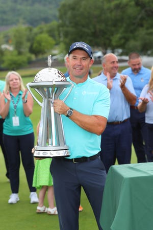 The 2022 Dick's Sporting Goods Open champion Padraig Harrington poses with his trophy, Aug. 21, 2022.