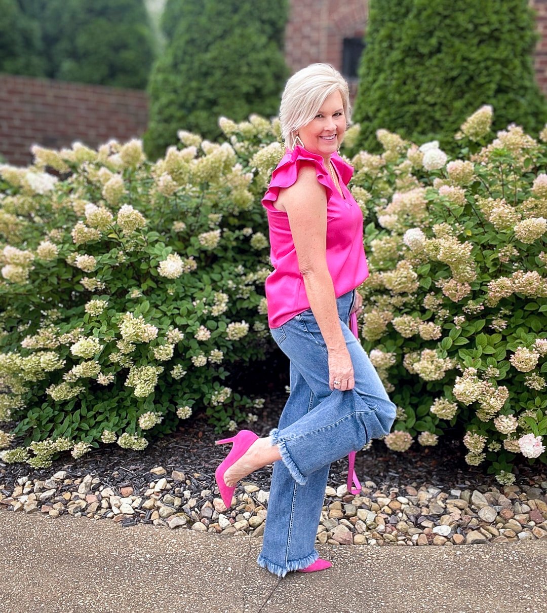 Over 40 Fashion Blogger, Tania Stephens is styling wide leg jeans with a pink ruffled top17