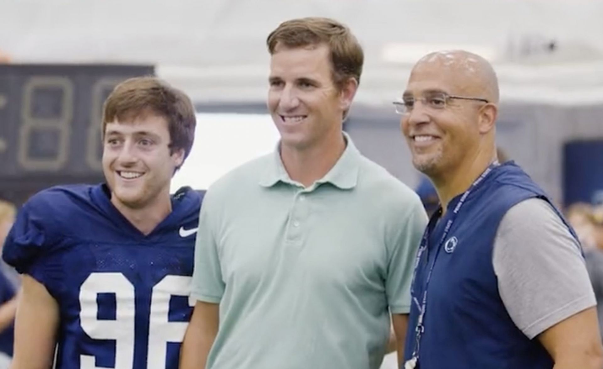 Former NFL QB Eli Manning with Penn State HC James Franklin and the walk-on.