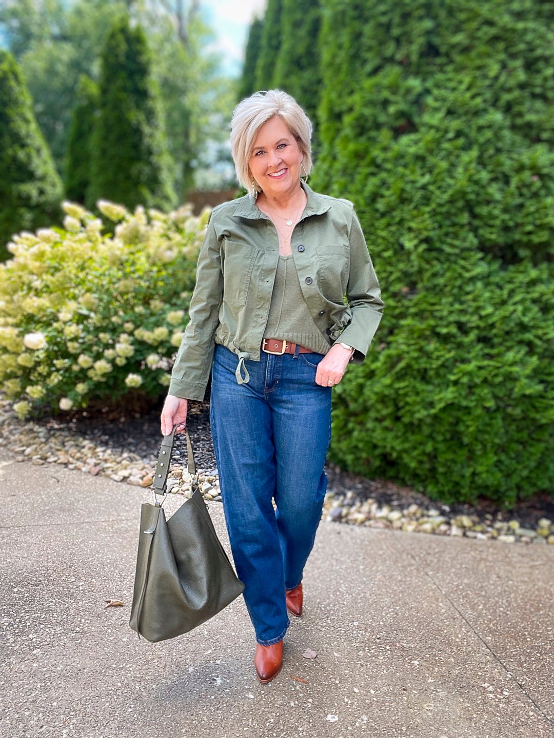 Over 40 Fashion Blogger, Tania Stephens is wearing an olive green jacket and sweater tank from Banana Republic 9