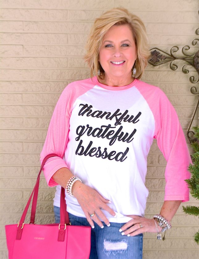 Over 40 Fashion Blogger, Tania Stephens is wearing a graphic tee
